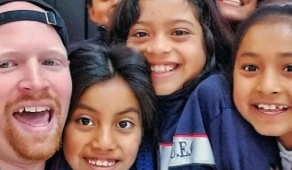 a TEFL teacher with his students