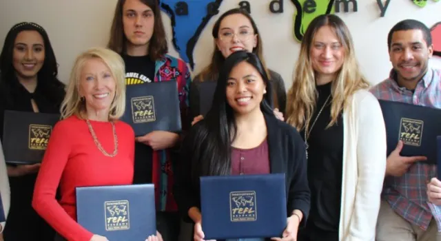 International TEFL Academy graduates holding TEFL Certificates