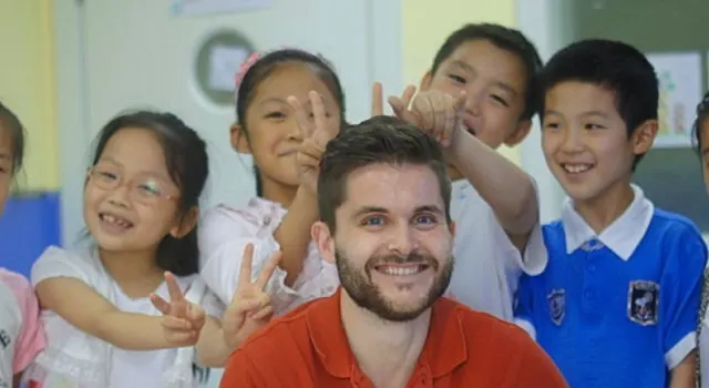 a TEFL teacher with his students