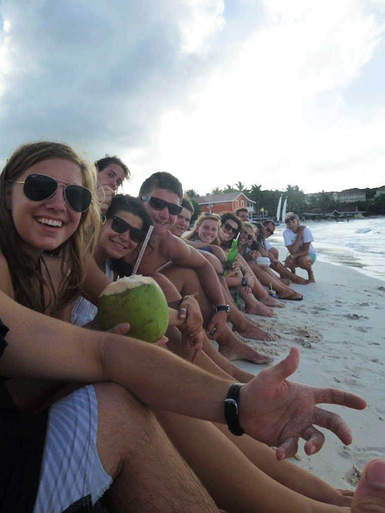 Drinking coconut water on the beat in Antigua