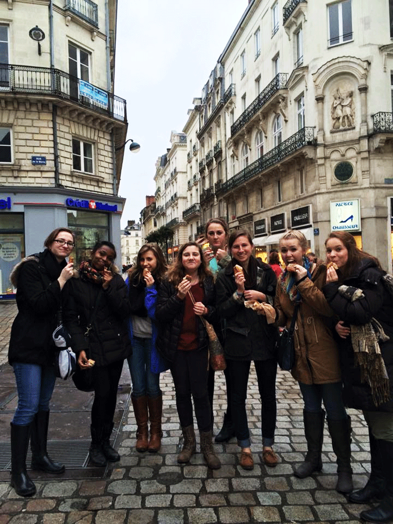 Eating baguettes on a street in Nantes, France