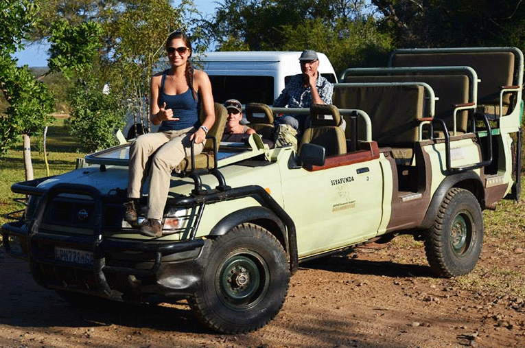 Team of people preparing for animal tracking in South Africa