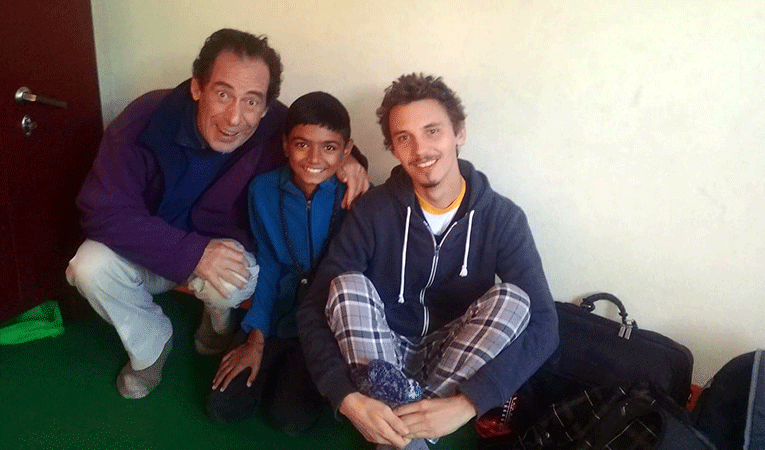 Three people in meditation centre