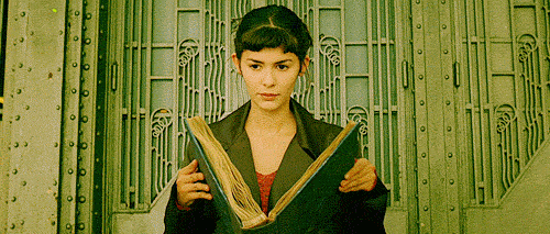 gif, Amelie closing big photo album and looking up