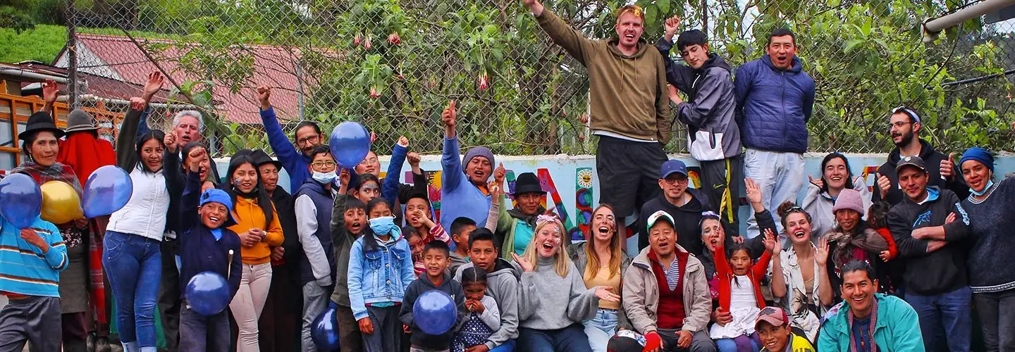 photo of a man with the mountains behind him