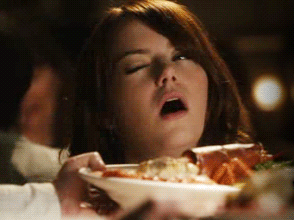 Emma Stone rolling her eyes at a plate of food