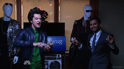 Two guys from Parks and Recreation dancing and shuffling money