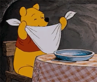 Gif, winnie the poo waiting happily for food with knife and fork
