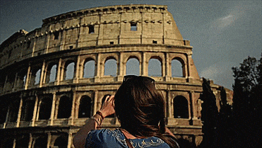 Woman taking picture of Colosseum in Rome