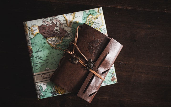Journal on top of map of world