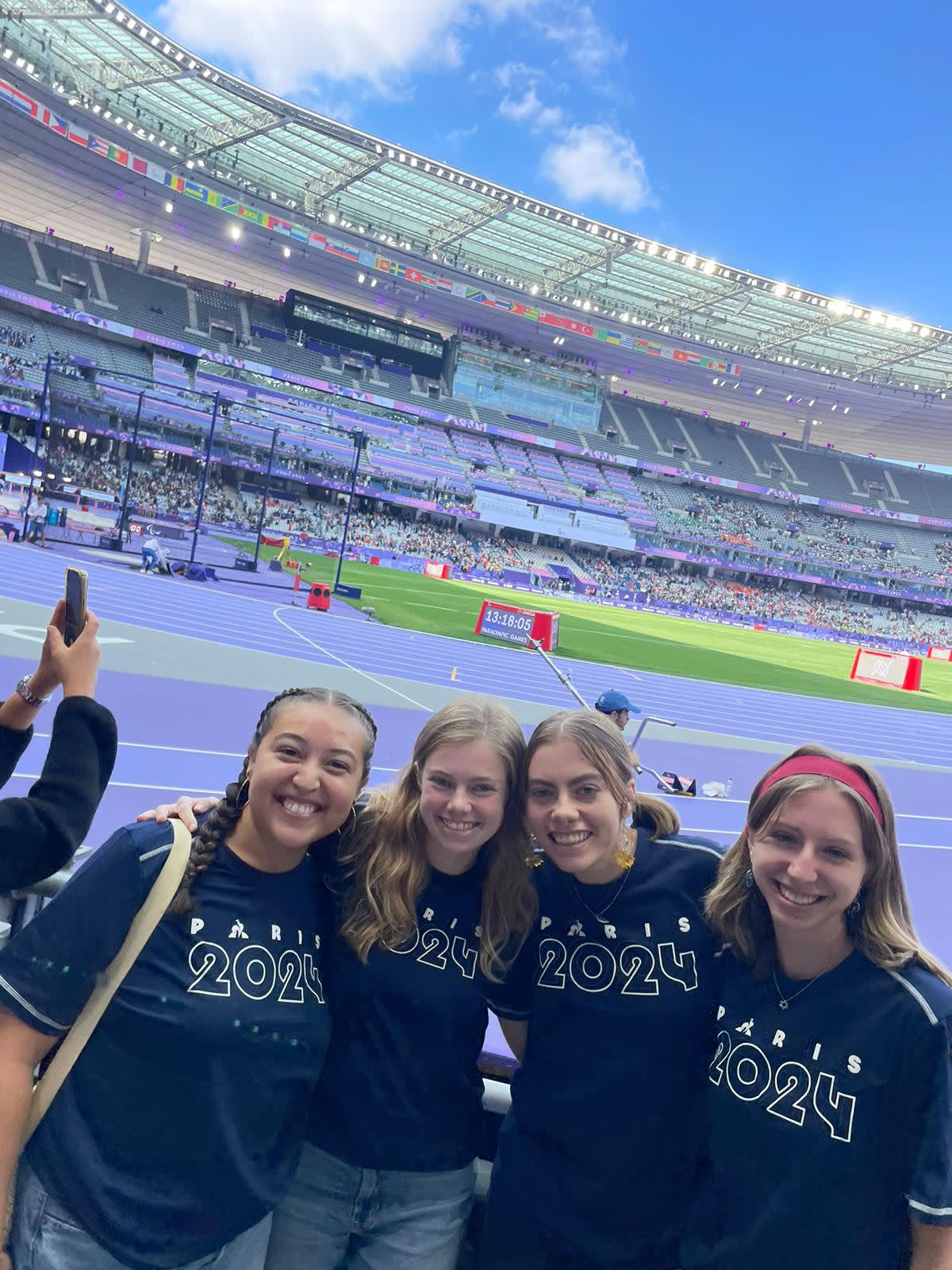 3 students at Paris France Athletic stadium for Para Olympics
