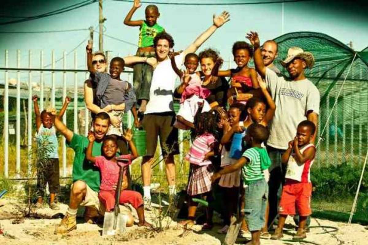 group of volunteer and children at program site
