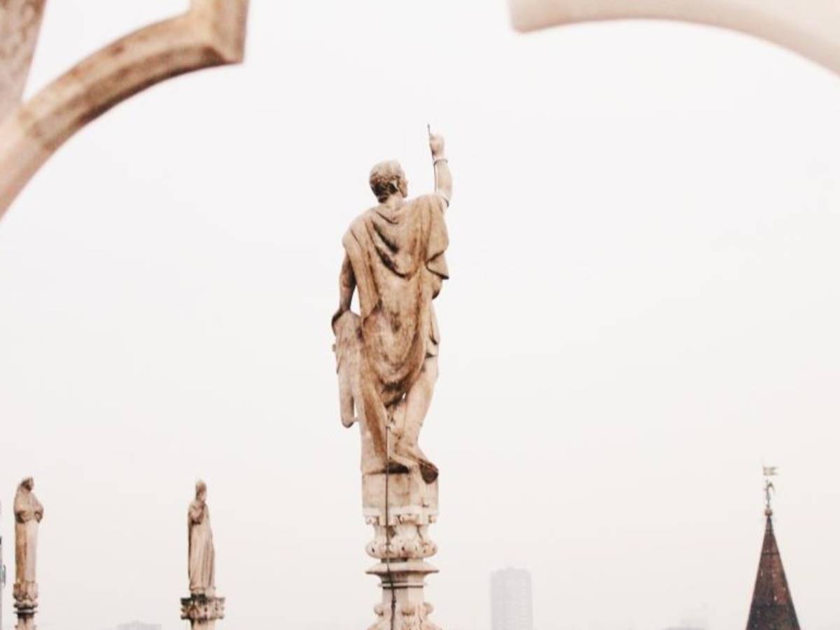 A Milanese sculpture looks over a cloudy sky.