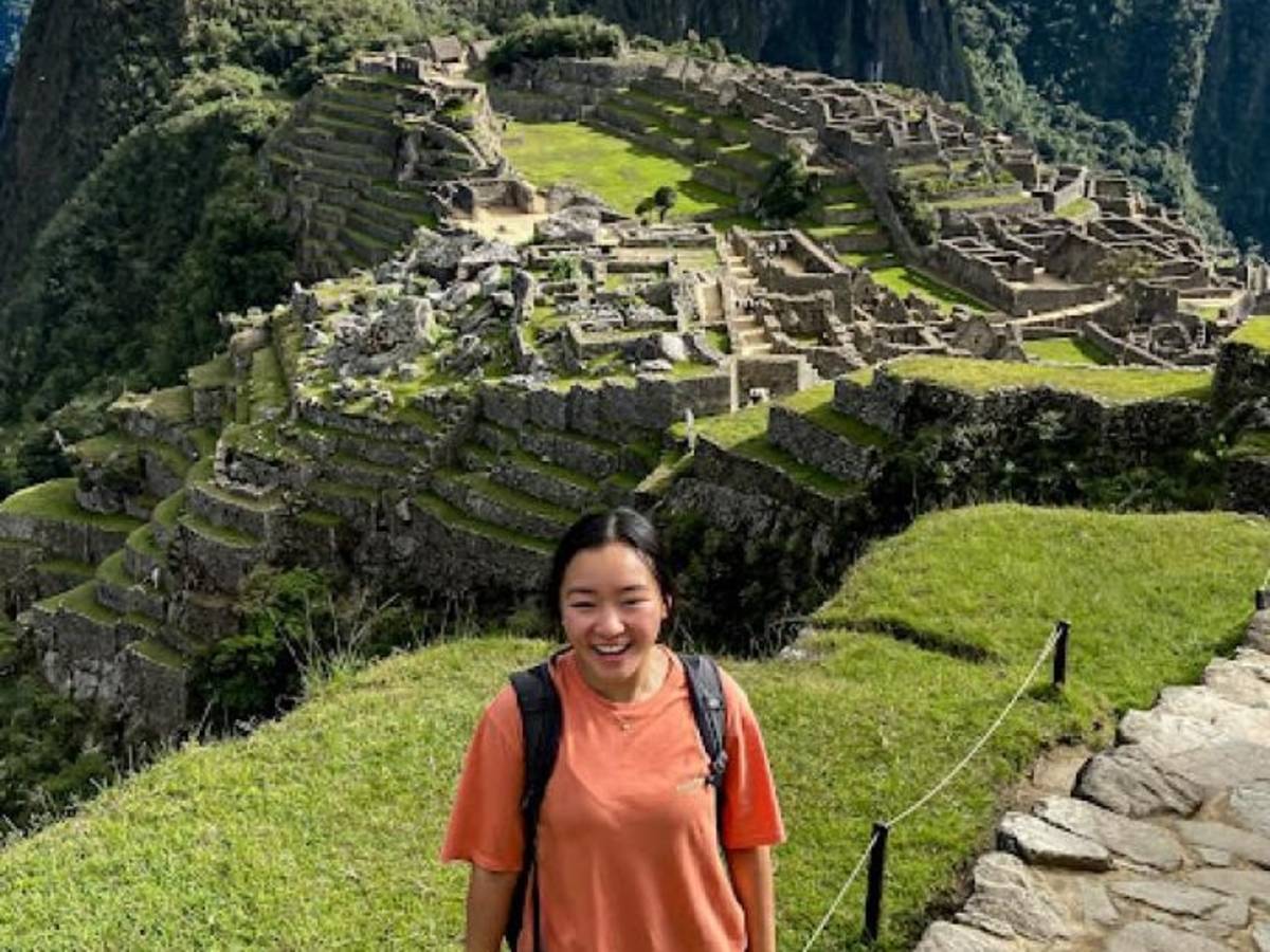 a student in front of the Machu Picchu Incan ruins