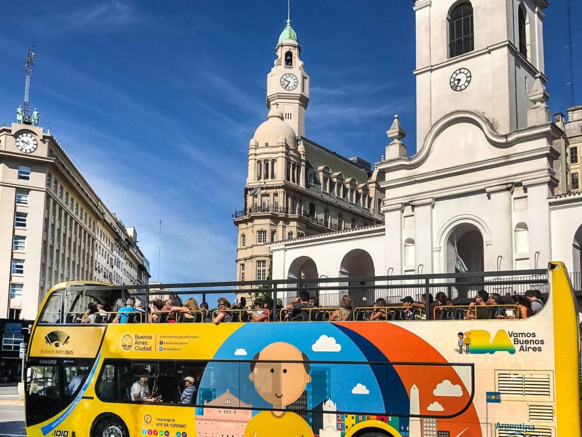 a tour bus drives through downtown Buenos Aires