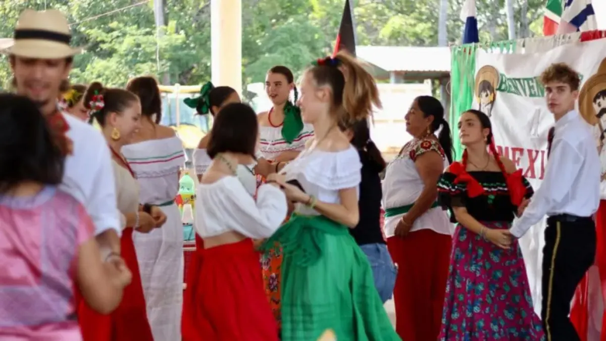 AFS students in Mexico participating in traditional dances with peers