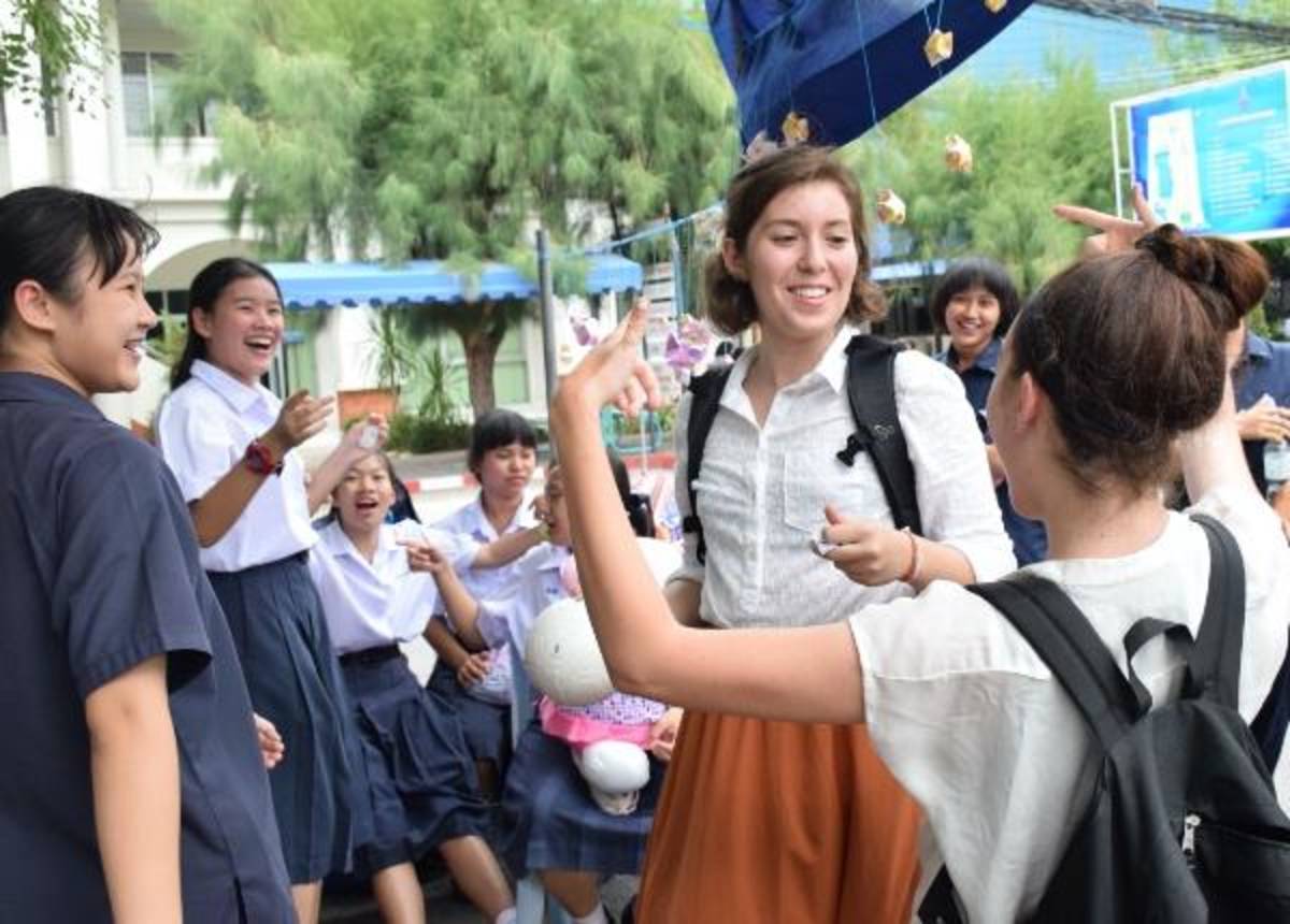 american and thai students talking in thailand