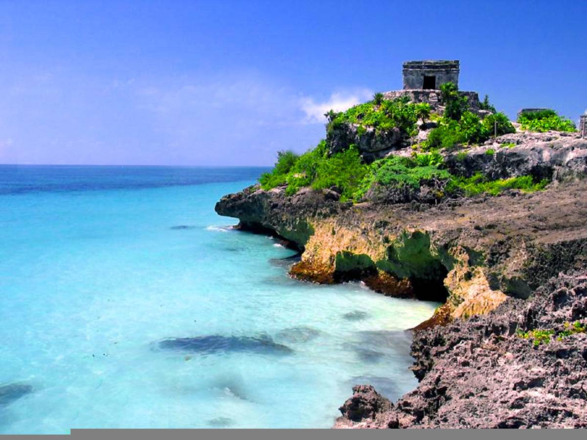 Ancient Mayan ruins overlooking turquoise Caribbean waters in Tulum, Mexico, a top destination for TEFL teachers