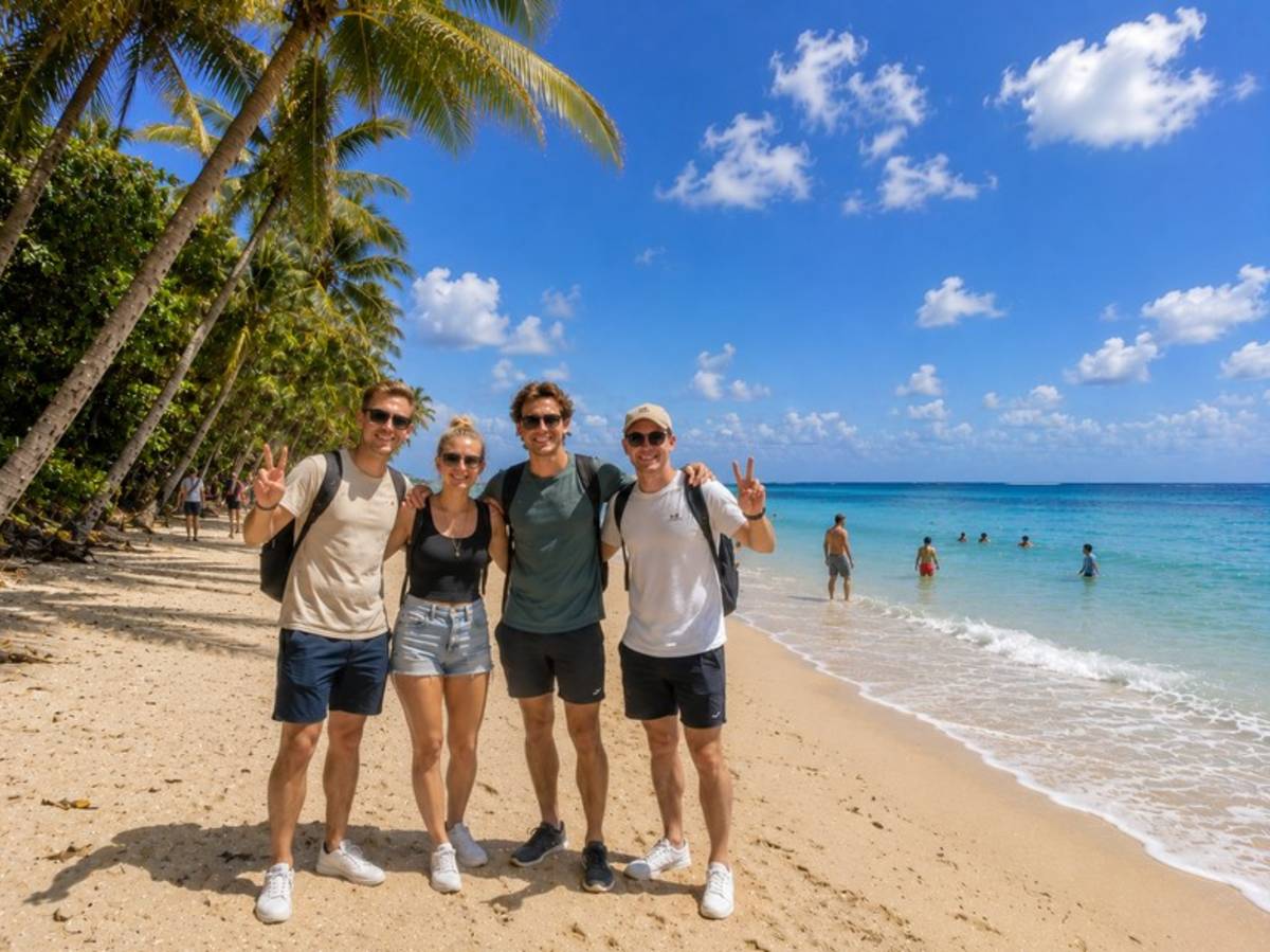 Four travellers relaxing on a tropical Costa Rican beach