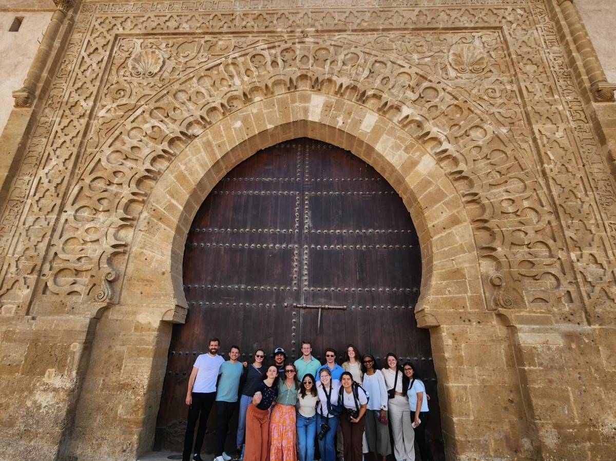 Group of staff and students in front of ornate building in Rabat