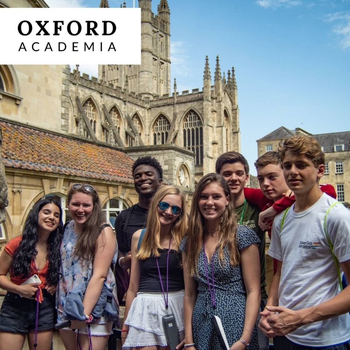 group of students posing in front of historic Oxford architecture