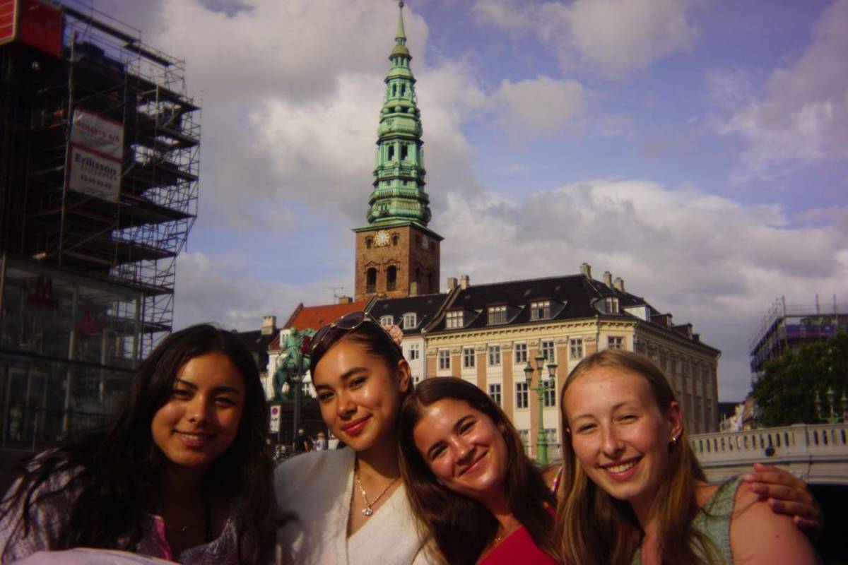 Historic building behind program participants in Copenhagen