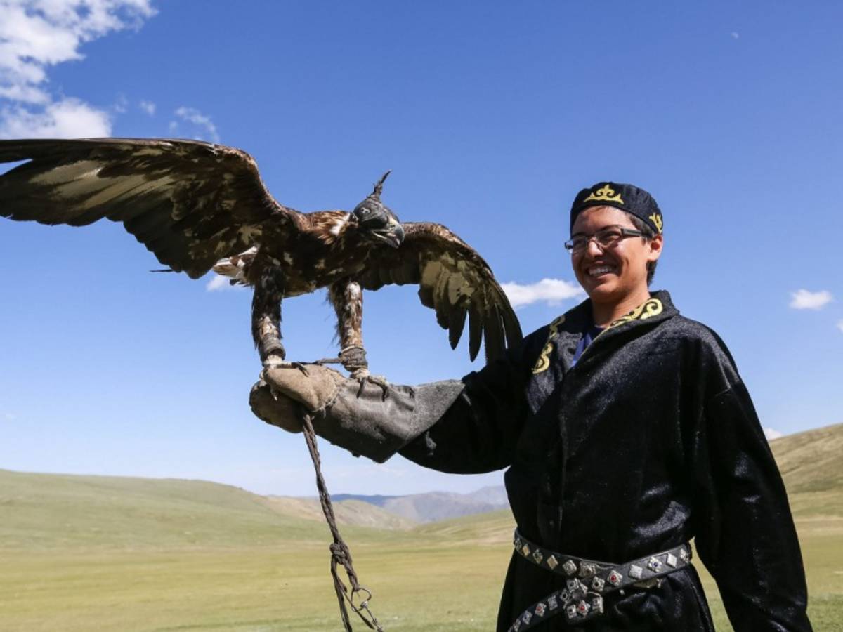 Holding golden eagle