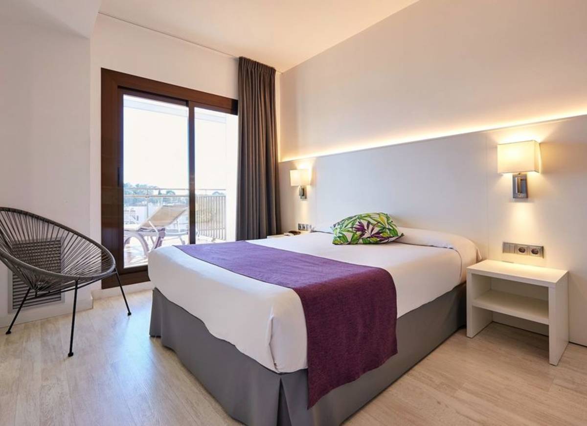 hotel room with bed and veranda