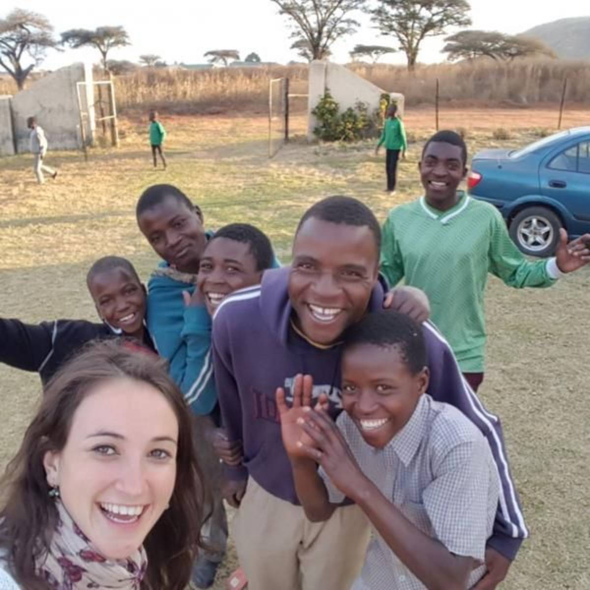 happy children and volunteer