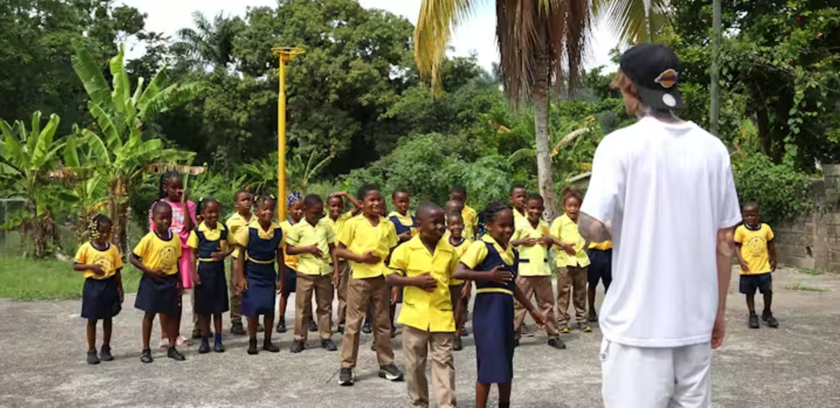 IVHQ Volunteer Teaching Children in Jamaica