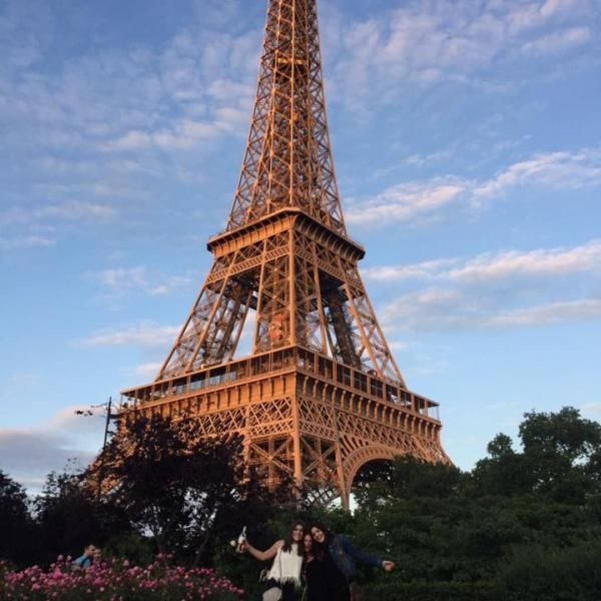 Paris interns posing in front of the Eiffel tower
