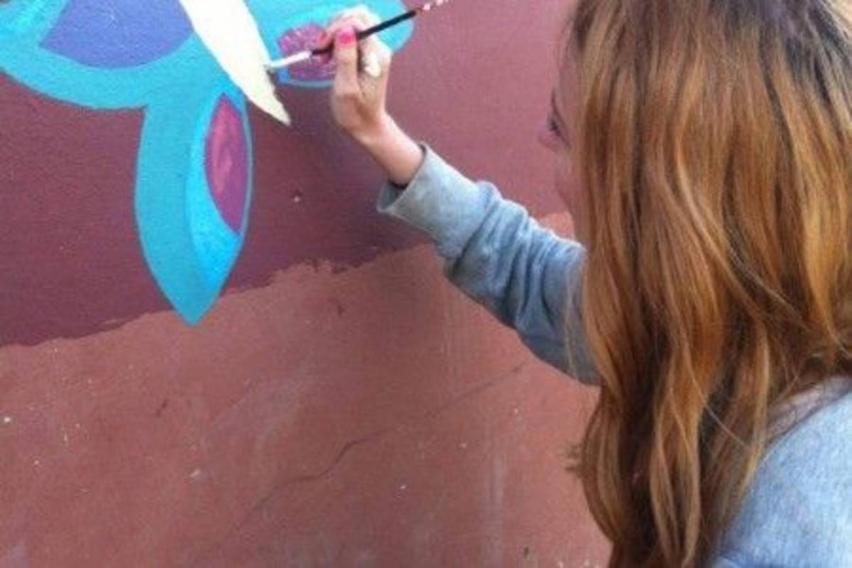 Volunteer during a mural painting