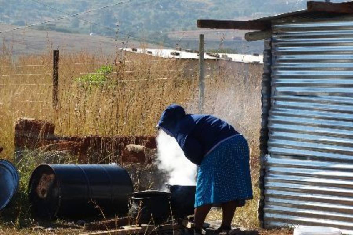 Woman cooking for pre-school students