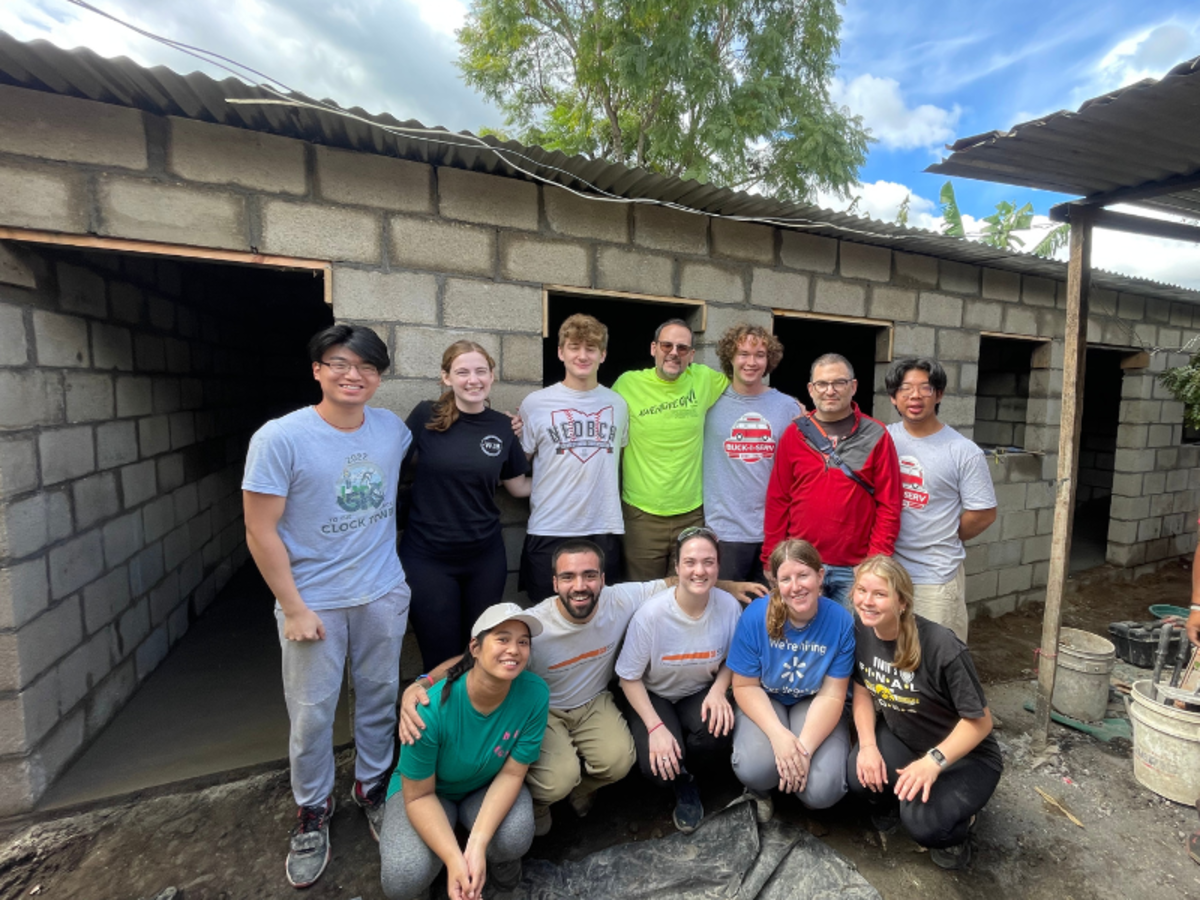 Our Volunteers abroad infront of the house they just finished.