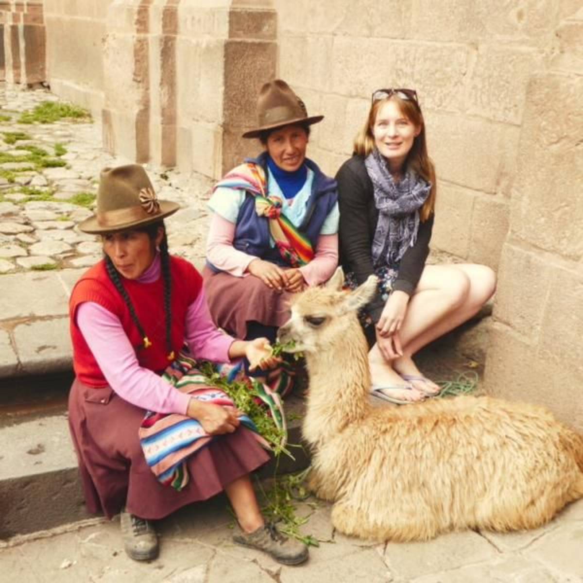 Posing with local women in Cusco Peru