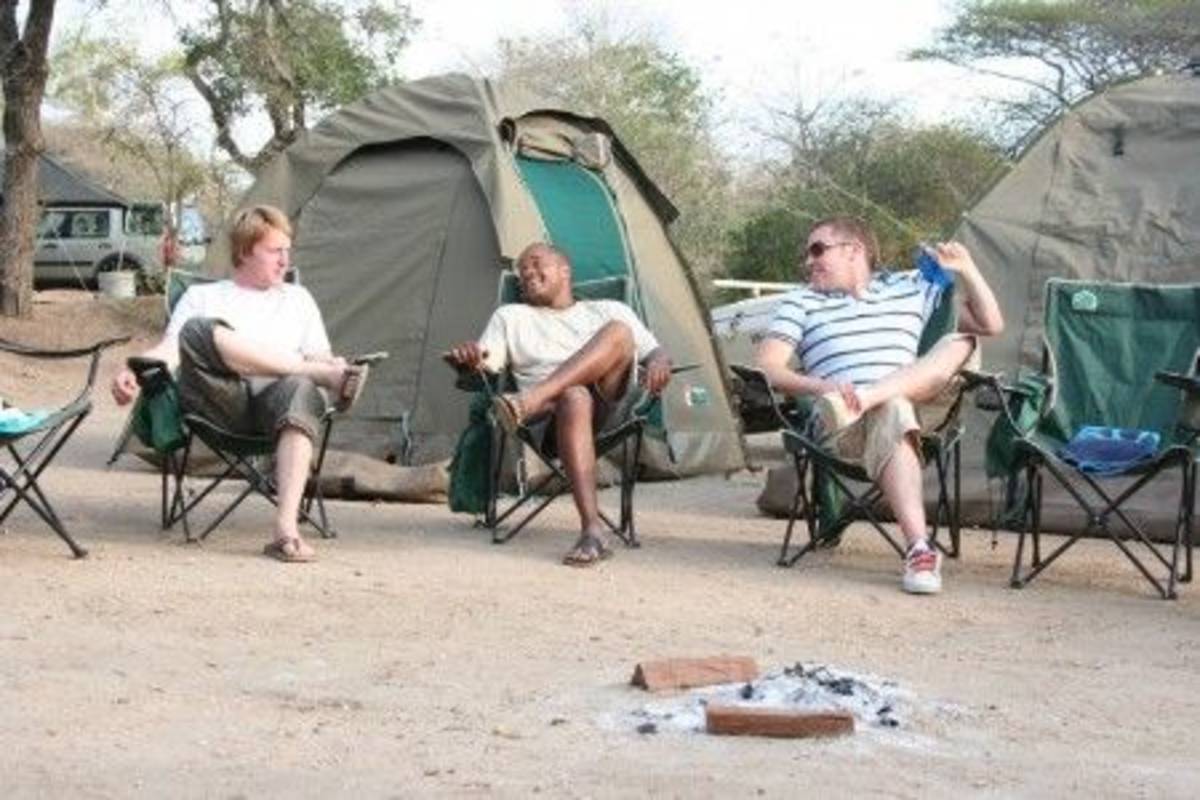 Sitting outside tents Volunteer Building with Kruger Safari in Swaziland