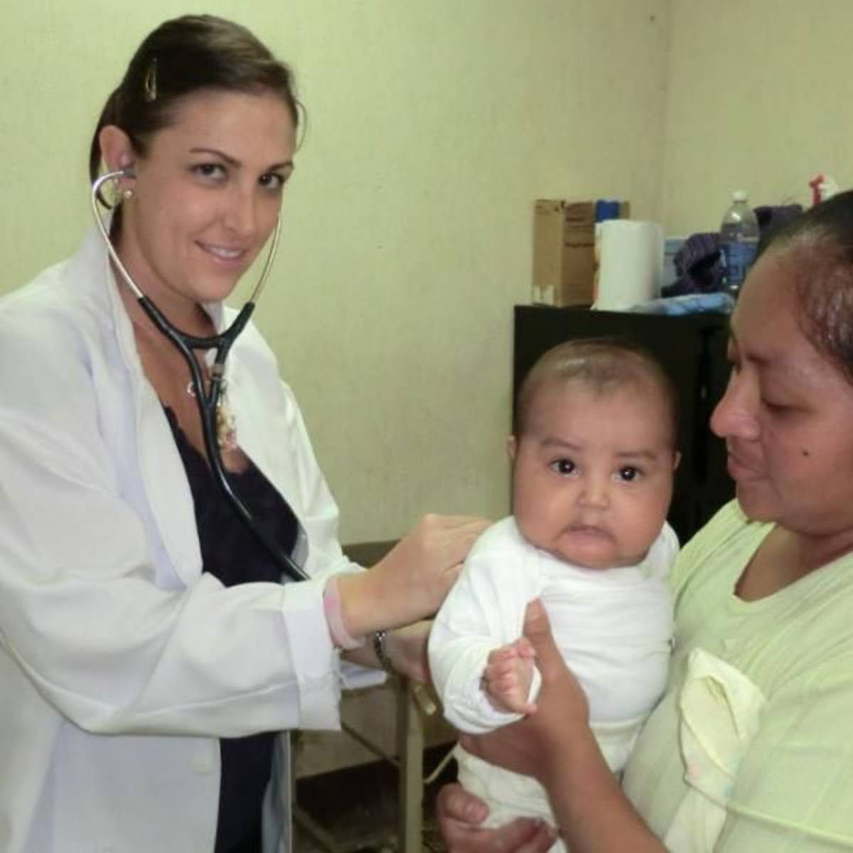 Medical Volunteer and a mother with child