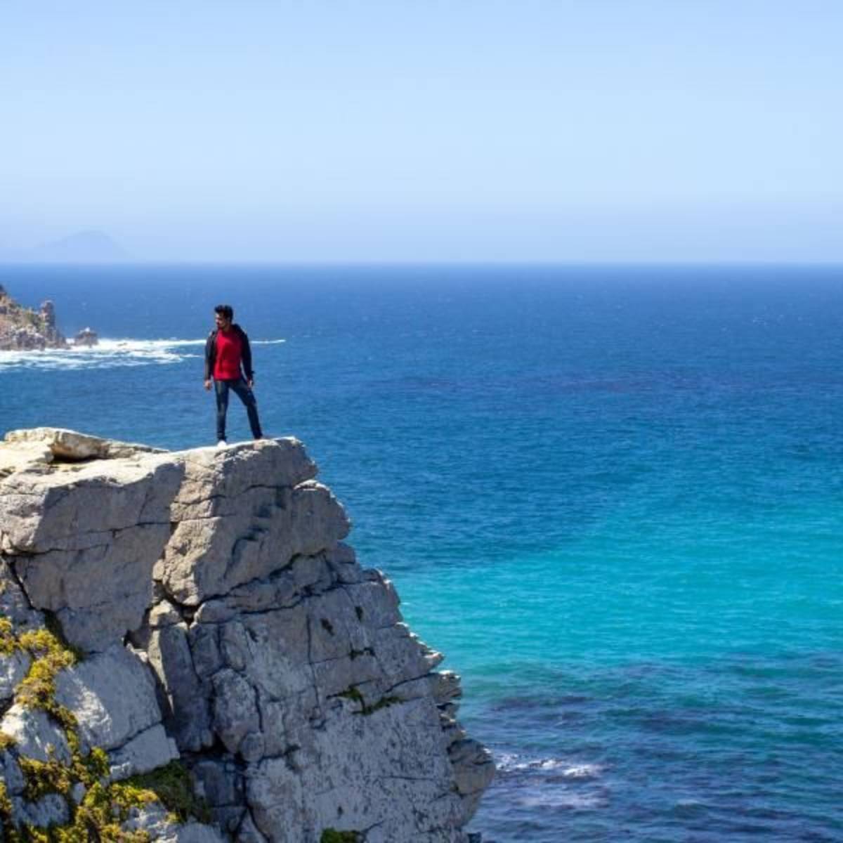 Man on top of a cliff