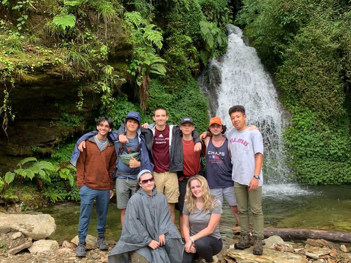 Student group in front of a waterfall in Nepal