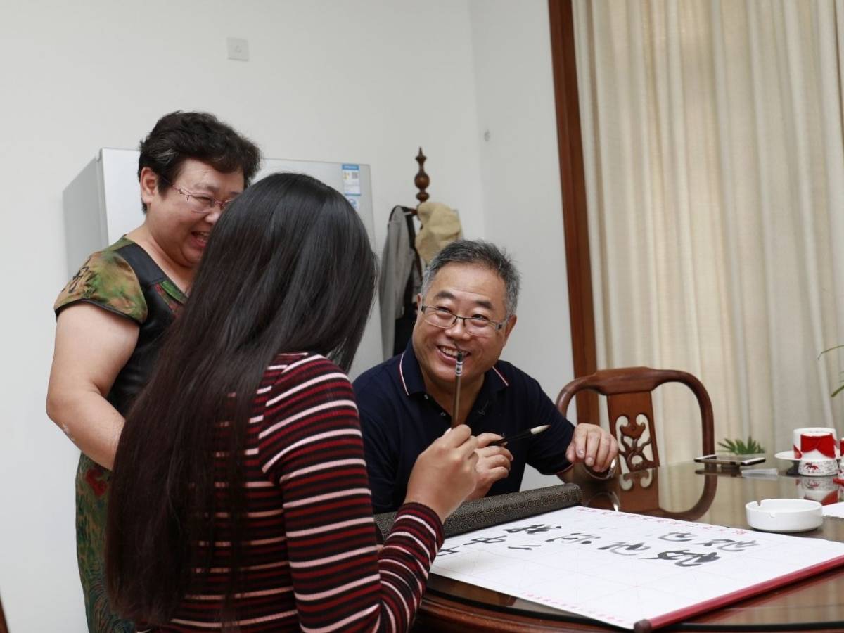 Student learning Chinese calligraphy in Shanghai
