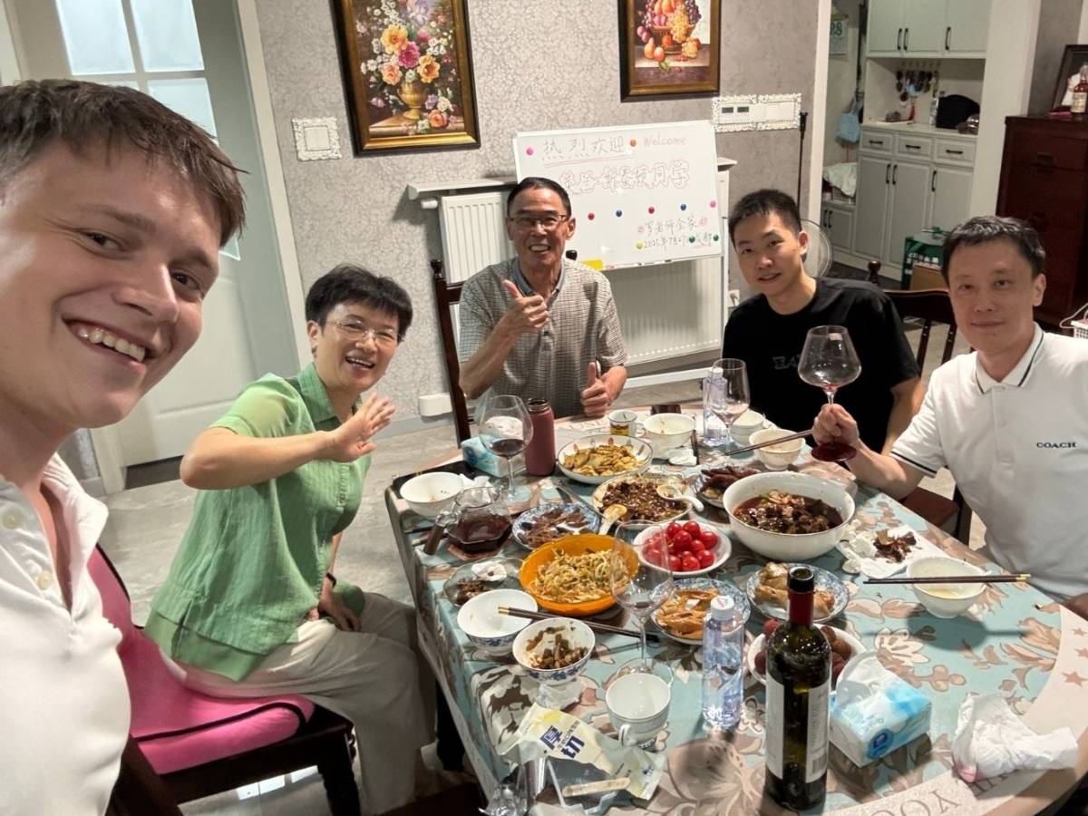 Student sharing a meal with his teacher and family in Chengdu
