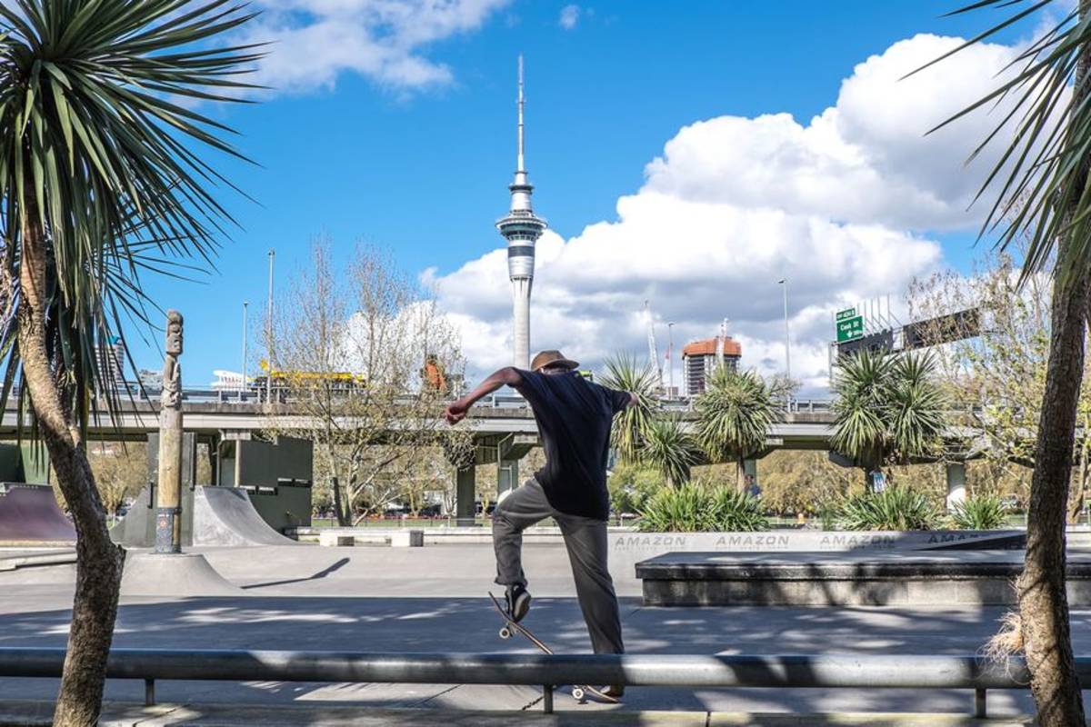 Student skateboarding at park in Auckland