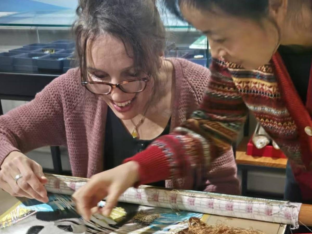 Student trying her hand at embroidery in Chengdu