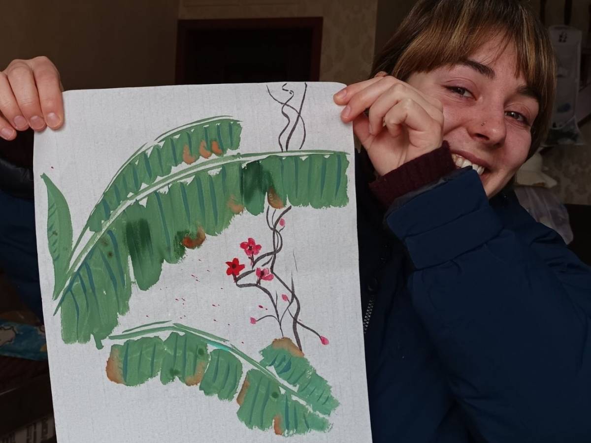Student with her Chinese painting in Chongqing