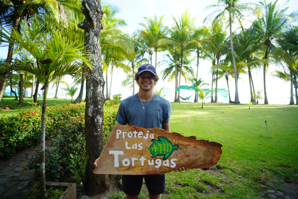 Student with Painted Sign