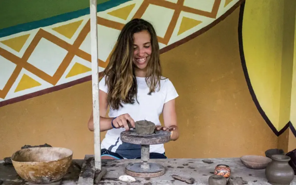 Student works with clay
