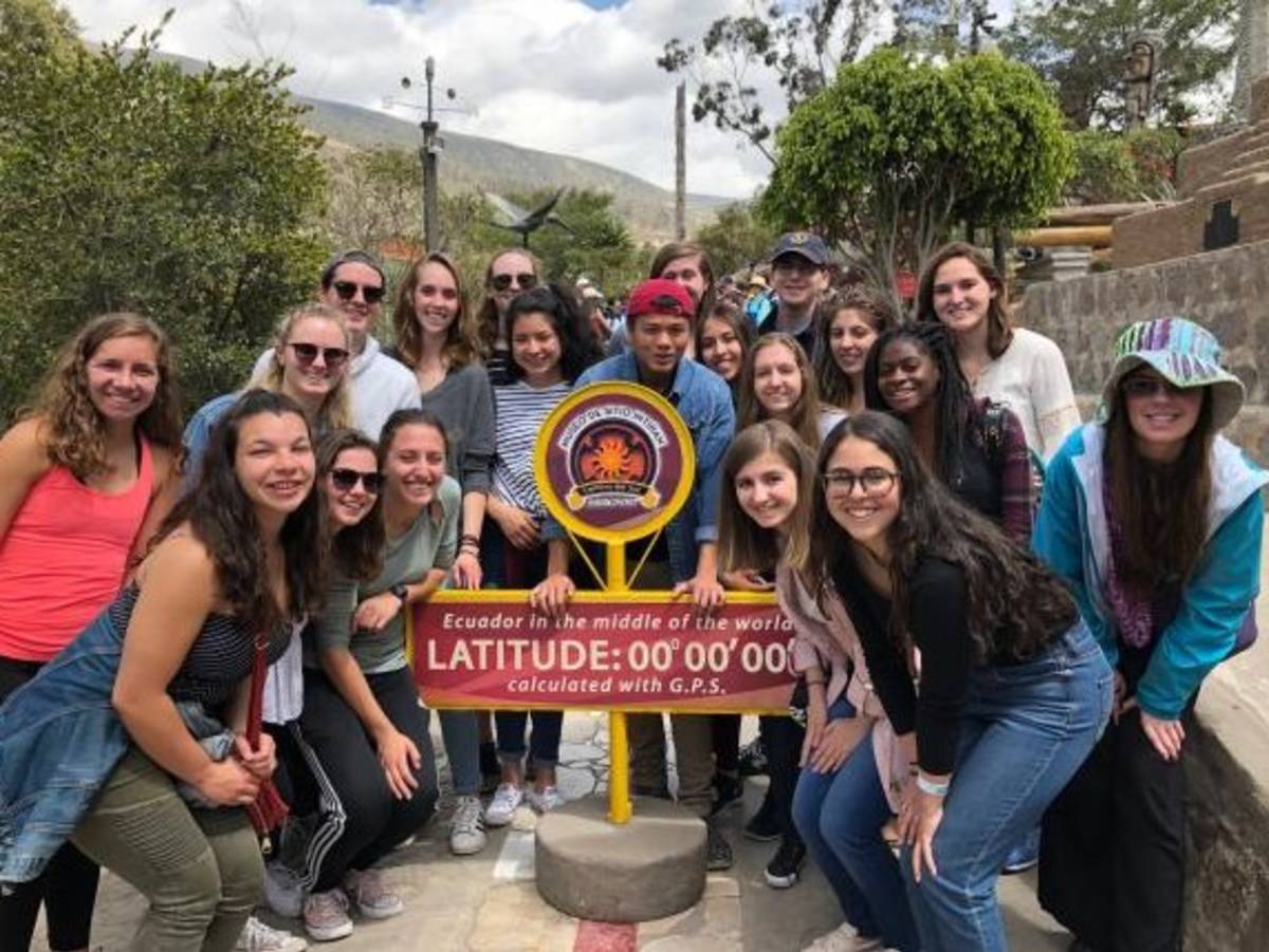 Students at the equator line in Ecuador.