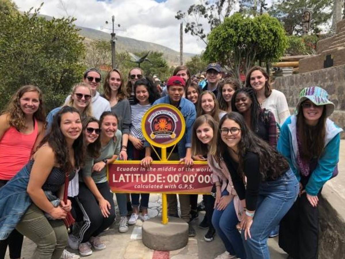 Students at the equator line in Ecuador.