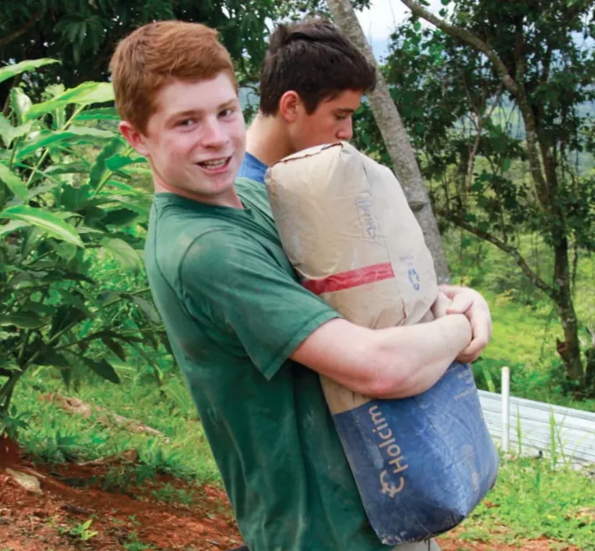 Students carry flour
