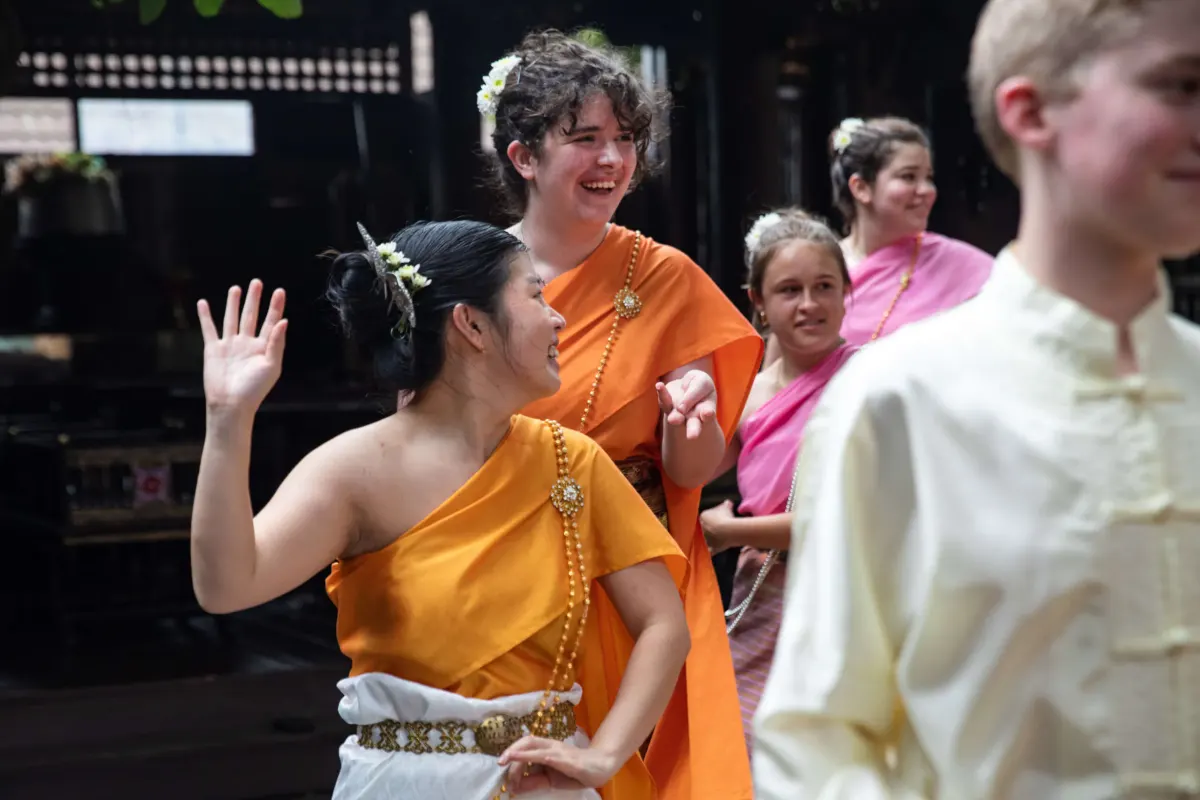Students dancing with locals